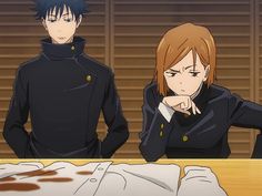 two anime characters sitting at a table