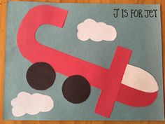 a piece of paper cut out to look like a car with clouds and the word j is for jets