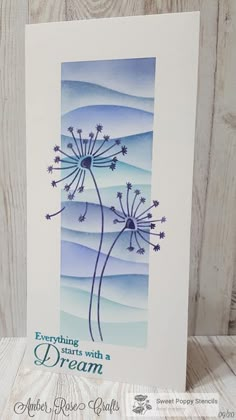 a greeting card featuring a dandelion with the words, everything starts with a dream