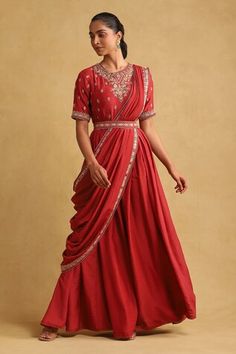 Red saree dress featuring thread embroidery with sequin embellishments. Comes with matching dupatta and belt. - Aza Fashions Traditional Drape Sequin Dresses For Designer Wear, Festive Draped Embellished Gown, Traditional Evening Dress For Diwali, Evening Saree Dress With Zari Work, Embellished Evening Dress For Navratri, Traditional Drape Zari Work Evening Dresses, Designer Draped Dress With Zari Work, Traditional Drape Dresses With Zari Work For Evening, Red Dress With Pallu And Traditional Drape