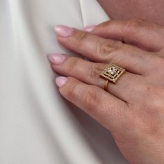 Experience the ultimate in elegance and luxury with our 18k Gold Filled CZ Princess Cut Squared Top Ring. This glamorous piece will elevate any outfit and add a touch of sophistication to your style. With its stunning design and sparkling stones, you'll feel like royalty every time you wear it. Metal: 18k Gold filled Available sizes: 6, 6.5,7, 7.5, 8, 9 , 10 Hypoallergenic Water-resistant Handcrafted in Brazil Square Ring Designs, Gold Rings Women, Ring Designs Gold, Hand Chain Bracelet, 18k Gold Chain, Rings Women, Pearl Shop, Letter Ring, Square Ring