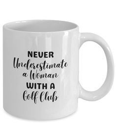 a white coffee mug that says never underestimate a woman with a golf club