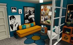 a living room with blue walls and pictures on the wall, including a yellow couch