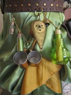 the purse is filled with various items such as cups and bottles, which are attached to chains