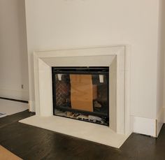 a fireplace with a piece of paper taped to it