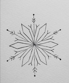 an ink drawing of a snowflake on white paper with black lines and dots