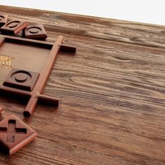 a close up of a piece of wood on a table with pieces of chocolate in the middle