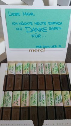 there are many chocolates in the box on the table and one has a sign that says, lebe maa, i don't heute hete ette entrach nuf danke