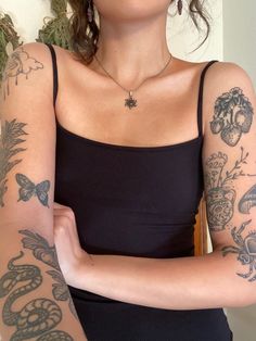 a woman with many tattoos on her arm