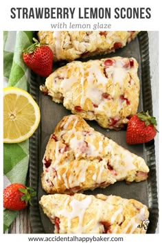 strawberry lemon scones with lemon glaze are on a tray next to strawberries