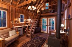 a living room filled with furniture and a fire place next to a window covered in wood