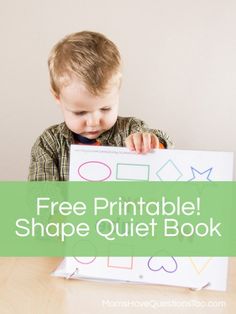 a young boy sitting at a table with a free printable shape quiet book