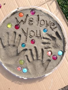 there is a sand cake that says we love you