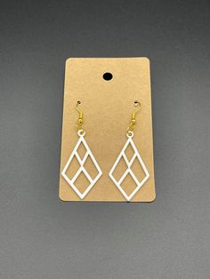 "Beautiful 3D printed custom earrings.   Size: 1.77\" tall x 0.98\" wide. Material: PLA plastic. Color: Multiple available Material: Made out of PLA plastic which is made out of corn and fermented plant starch.  How it's made: All products are made by me with a 3D printer.  Each item is made to order.  Meaning when you place an order, your item is made on demand specially for you.  Made in the California, USA. not a print farm or over seas. Since the item is 3D printed, there is a process of man Modern White Geometric Earrings, White Laser Cut Earrings As A Gift, White Laser Cut Earrings For Gift, White Pierced Drop Plug Earrings, Modern White Pierced Earrings, White Laser-cut Jewelry For Gifts, Modern White Earrings With Ear Wire, Boho Style Earrings, Custom Earrings