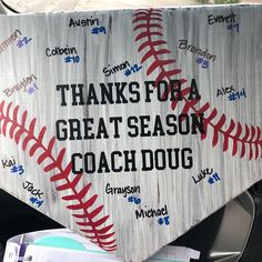 a baseball themed sign on the back of a car