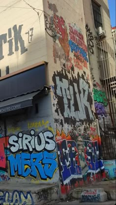 the side of a building covered in graffiti