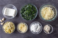 the ingredients for this dish include spinach, cheese, and sour cream in small bowls