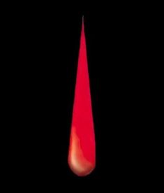 a blood drop on a black background with red light coming from the top and bottom