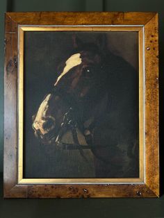 a painting of a horse in a wooden frame