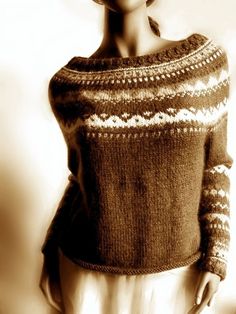 a woman in a sweater and skirt posing for the camera