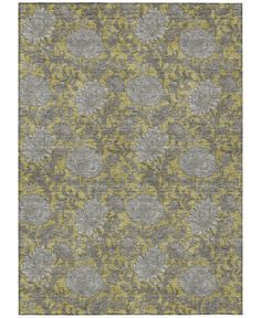 an area rug with grey and yellow flowers on it