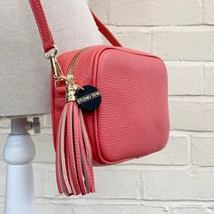 The last day to place Christmas orders for delivery within the UK is Monday the 18th by 11am. Merry Christmas from STUDIO TEW x Fall in love with the Darcy Bag - a stylish and timeless leather crossbody bag with a beautiful tassel and adjustable strap. Perfect for every day use, this bag is sure to bring out your sense of fashion! Get yours today - you won't regret it! ABOUT THE DARCY BAG Made from genuine Italian leather Gold metal hardware  Tassel detail One internal slip pocket, suitable for cards and keys Dimensions: L: 21CM H: 14.5CM D: 7CM Detachable & adjustable matching leather strap Length of strap including clasps - up to 135cm Handmade in Italy Available in a variety of colours All orders are dispatched in 1-3 working days, from the UK, via Royal Mail. Bag With Tassel, Butterfly Scarf, 3rd Anniversary Gifts, Bridesmaid Bags, 3rd Anniversary, Bags Leather Handbags, Tassel Bag, Leather Handbag, Italian Leather