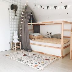 a child's bedroom with a bunk bed and rug