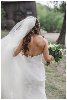 a woman in a wedding dress holding a bouquet