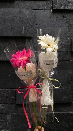 a person holding flowers and wrapped in cellophane