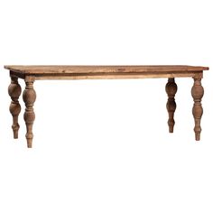 an old wooden table with turned legs on a white background for display or montage