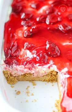 there is a cake with cherries on it in the pie dish, ready to be eaten