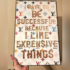 someone holding up a poster with the words i have to be successful because i like expensive things