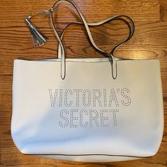 Approximately 15in Wide And 12in Tall Vinyl Like Material Casual White Victoria's Secret Bag, Trendy White Victoria's Secret Shoulder Bag, Victoria's Secret Beige Shopping Bag, Victoria's Secret White Shoulder Bag For Daily Use, Victoria's Secret White Travel Bag, Beige Victoria's Secret Shopping Bag, Victoria's Secret White Bags For Everyday Use, White Rectangular Victoria's Secret Shoulder Bag, Victoria's Secret White Rectangular Bag