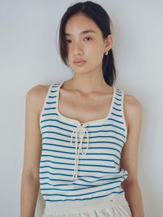 This is a mondern and comfortable top by URAGO that is made out of high quality and sturdy material. With distinctive mood of the design and comfortable wear, you can style it for your casual daily outfit.- Sea shell embellishment point on the hem- String ribbon point - Casual and trendy mood Casual Cotton Knit Vest Top, Casual Sleeveless Knit Top For Everyday, Sleeveless Knit Tops For Loungewear, Trendy Cotton Knit Vest Top, Cotton Knit Vest Top For Summer, Casual Sleeveless Knit Top, Knit Vest Top For Day Out, Cotton Sleeveless Knit Vest Top, Cotton Knit Tank Top For Day Out