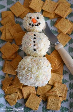 two snowmen made out of crackers and cheese