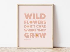 a pink poster with the words wild flowers don't care where they grow on it