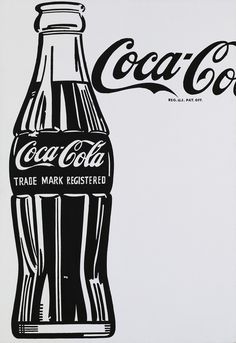 a coca - cola advertisement is displayed on the wall