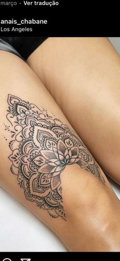 a woman's leg with a tattoo on it that has a flower in the middle