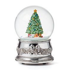 a snow globe with a christmas tree inside