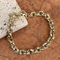 14KT yellow gold knife-edge, oval, interlocking chain link bracelet with toggle clasp. Great, chunky links bracelet to wear on its own or with an arm full of bracelets! Length: 8" Chain width: 7.95mm Weight: 9.25 grams Stamped 14K Easy to use toggle clasp Made in Italy Classic Chain Bracelet With Chunky Oval Links, Classic Chunky Chain Bracelet With Oval Links, Classic Gold Chunky Chain Bracelet, Formal Gold Bracelet With Chunky Oval Link Chain, Yellow Gold Bracelet With Chunky Oval Link Chain, Gold-tone Oval Link Chain Bracelet With Lobster Clasp, Modern Oval Gold Chain Bracelet, Modern Gold Chain Oval Bracelet, Chunky Chain Oval Bracelet