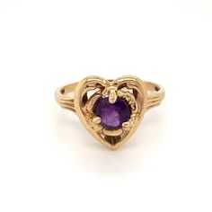 FREE shipping on all orders! FREE 5 Day Returns! Learn More. From our Vintage collection, one-of-a-kind, the perfect gift for Valentine's Day! Our Sweetheart Amethyst 14K Yellow Gold Ring. Size 5.75. Sweetheart features a 5.00 MM round faceted amethyst set in a circle within a heart motif. The heart wants what the heart wants. Size: 5.75 Hallmarks: ESEMCO 14K Total Piece Weight: 1.20 dwt Do Good: We donate 2% of monthly SALES to Girls Not Brides org members. Vintage jewelry may contain minor mar Heart-shaped Amethyst Ring For Valentine's Day, Heart Shaped Amethyst Ring For Valentine's Day Gift, Heirloom Heart Ring With Birthstone For Valentine's Day, Heirloom Heart-shaped Gemstone Ring, Valentine's Day Heirloom Heart Ring With Birthstone, Vintage Gold Amethyst Birthstone Ring, Vintage Promise Ring For Valentine's Day, Vintage Gold Heart Ring With Birthstone, Vintage Purple Amethyst Ring For Anniversary