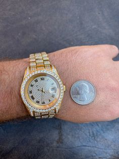 Mens iced flooded out hip hop watch
41mm - nice large size
Presidential design with date
Roman numeral iced dial

14k gold PVD finish over 316F Stainless steel - best quality.never change color or fade
 
Designed in Italy with Japan movement (quartz mechanism battery operated with 38 jewels)
15ct man made diamonds micropave - NOT GLUED RHINESTONES
Look just like real diamonds and cant tell difference without microscope
(There are many watches being sold for $20-100 online but they Hip Hop Watches, Fade Designs, Diamond Tester, Man Made Diamonds, Roman Numeral, Roman Numerals, Micro Pave, Real Diamonds, Natural Diamonds