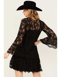 Channel your inner Stevie Nicks with this black lace dress with flare sleeves. The splender of this beautifully designed cotton blend lace dress can't be denied. It is a two piece dress with a separate lining. The inspiring sleeves flare out and have scalloped edges as well as the hemline. Import. Machine wash cold with like colors only. Non-chlorine bleach when needed line dry warm iron if needed. Perfect lace dress for any cowgirl. Perfect for the rodeo, trip to Nashville or a country music co Bell Sleeve Mini Dress, Black Bell Sleeve Dress, Flare Sleeves, Lace Crochet, Black Lace Dress, Romper With Skirt, Lace Mini Dress, Two Piece Dress, Women Lace