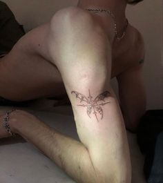 a man with a tattoo on his leg