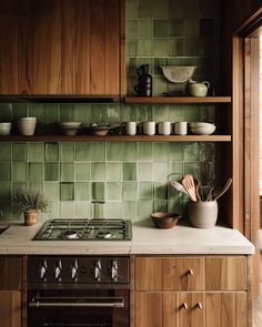 Playful 70s kitchen with colorful small appliances Use Of Space In Interior Design, Unique House Remodel Ideas, 70s Kitchen Inspiration, 1970s Kitchen Aesthetic, Mid Century Modern Kitchen Dark Cabinets, Green Midcentury Modern Kitchen, 1970s Inspired Kitchen, Green Backsplash Wood Cabinets, Mcm Kitchen Ideas