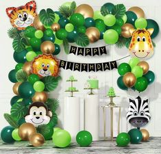 an animal themed birthday party with balloons and decorations