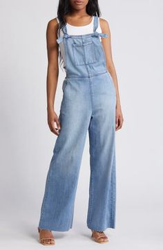 Raw hems give lived-in appeal to these laid-back overalls cut with a relaxed, straight-leg fit. 29" inseam Square neck Adjustable buckle straps 73% cotton, 27% rayon Machine wash, tumble dry Imported Medium Wash Relaxed Fit Bib Front Jeans, Trendy Light Wash Straight Leg Overalls, Cotton Overalls With Frayed Hem, Casual Straight Leg Light Wash Overalls, High Rise Medium Wash Cotton Overalls, High Rise Cotton Overalls In Medium Wash, Casual Medium Wash Overalls With Frayed Hem, Fall Light Wash Straight Leg Denim Jumpsuit, Straight Leg Denim Jumpsuit In Light Wash For Fall