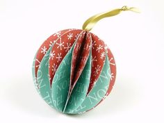 an ornament is decorated with red, green and white ornaments