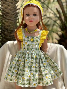 a doll wearing a dress and yellow headband