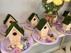 three plates with bird houses and flowers on them